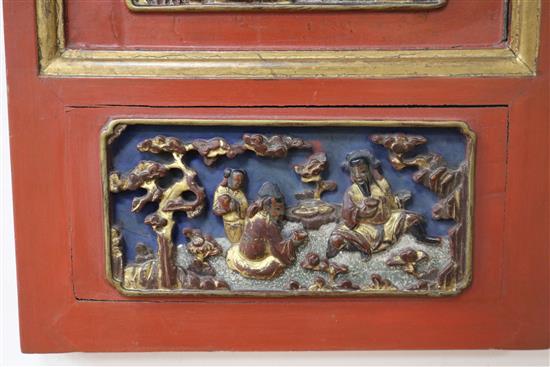 A Chinese gilt and red lacquered relief panel 84 x 32cm